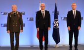 Russia's Deputy Defence Minister Alexander Fomin (left) and Deputy Foreign Minister Alexander Grushko with Nato Secretary General Jens Stoltenberg (right) in Brussels on 12 January. (© picture alliance/dpa/Sputnik/Alexey Vitvitsky)