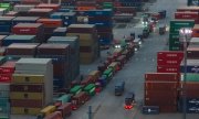 Lorries queue at the container terminal in Nanjing, China, on 8 April. (© picture alliance / Photoshot)