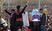 PKK supporters with photos of Öcalan at a rally during the Kurdish Newroz festival in Diyarbakır in March. (© picture alliance / Sipa USA / SOPA Images)